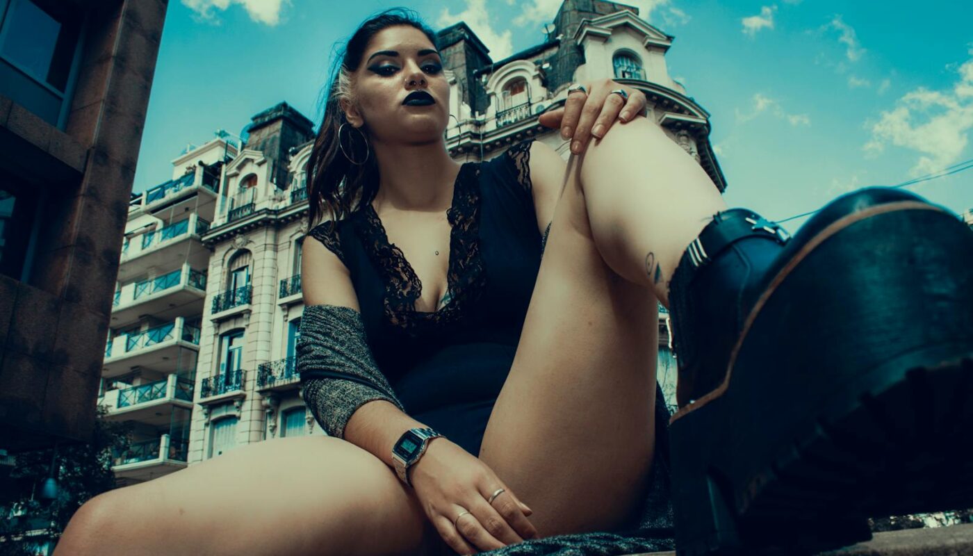 Woman Sitting On Fence